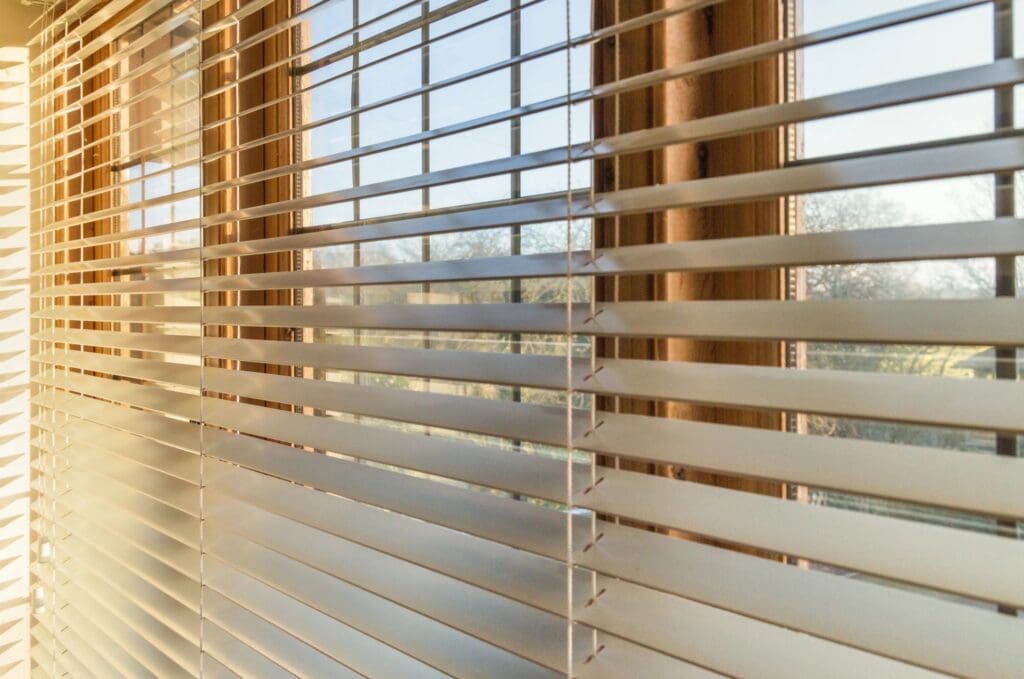 windows on a residential home with blinds